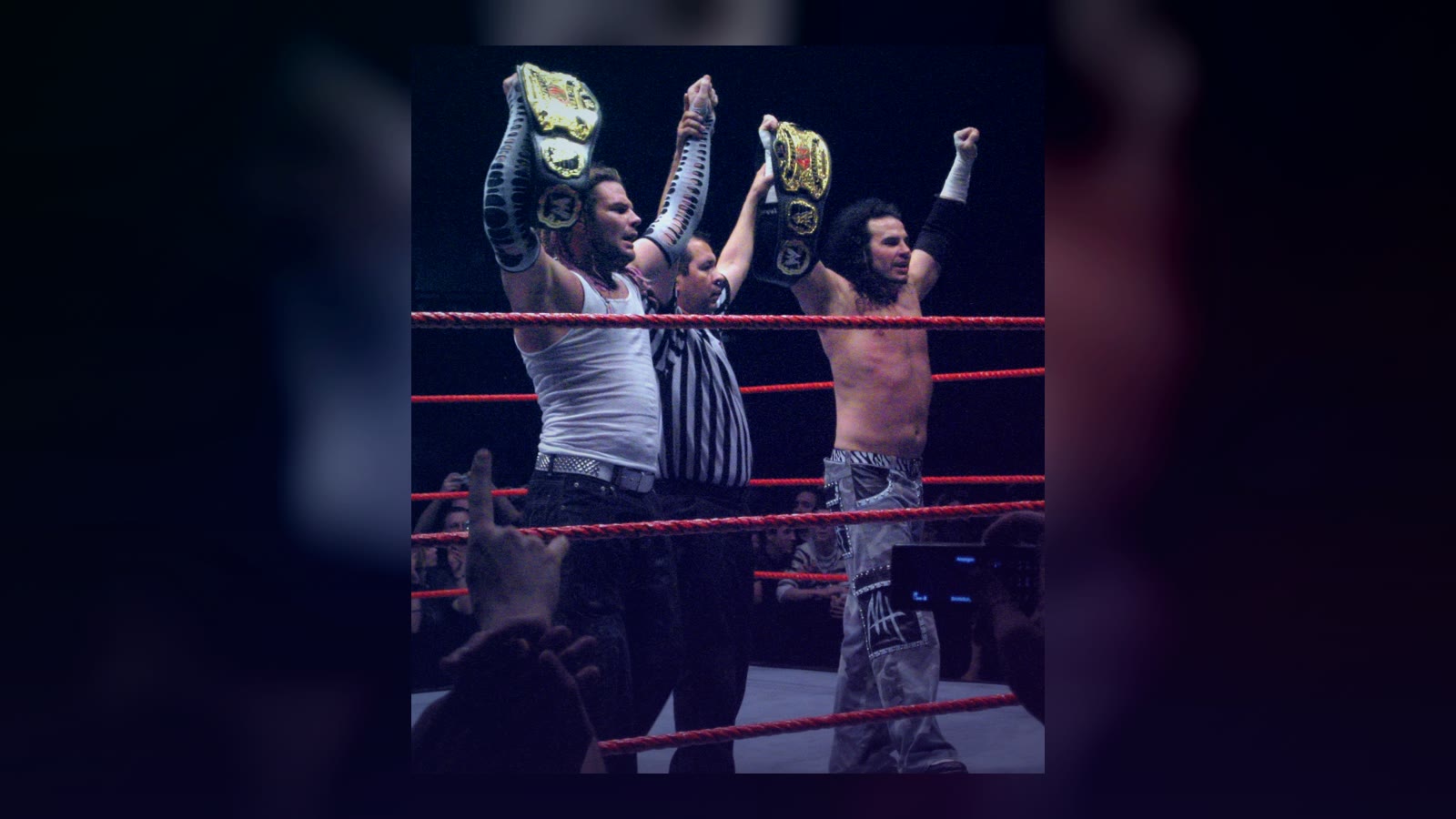 Jeff Hardy and Matt Hardy posing together as World Tag Team Champions