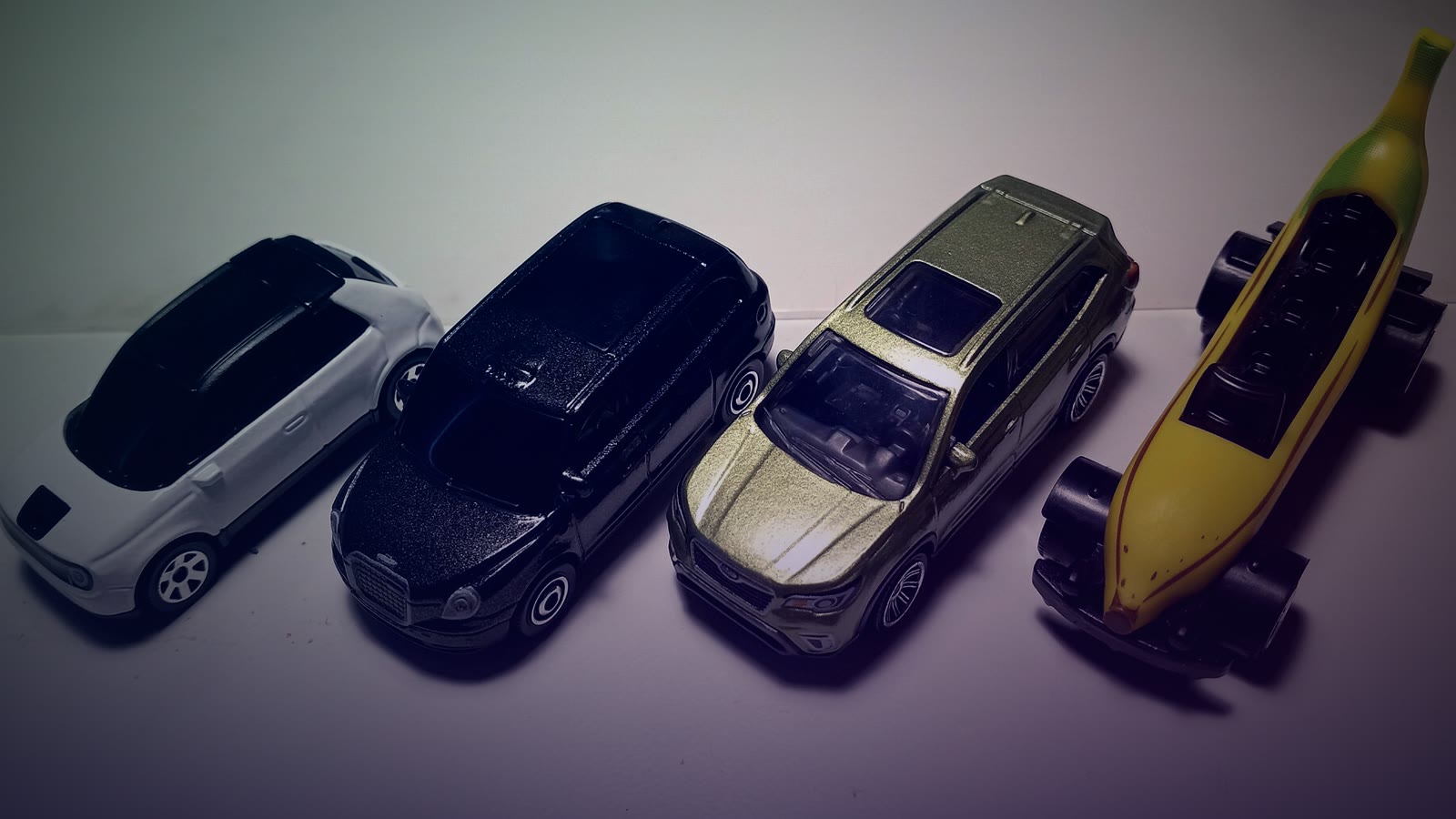 A collection of various Matchbox die-cast toy cars from 2020 to 2021, showing multiple colorful miniature vehicles