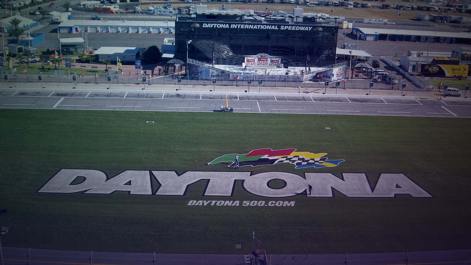 Aerial view of the Daytona International Speedway showing the distinctive oval track layout and grandstands along the frontstretch