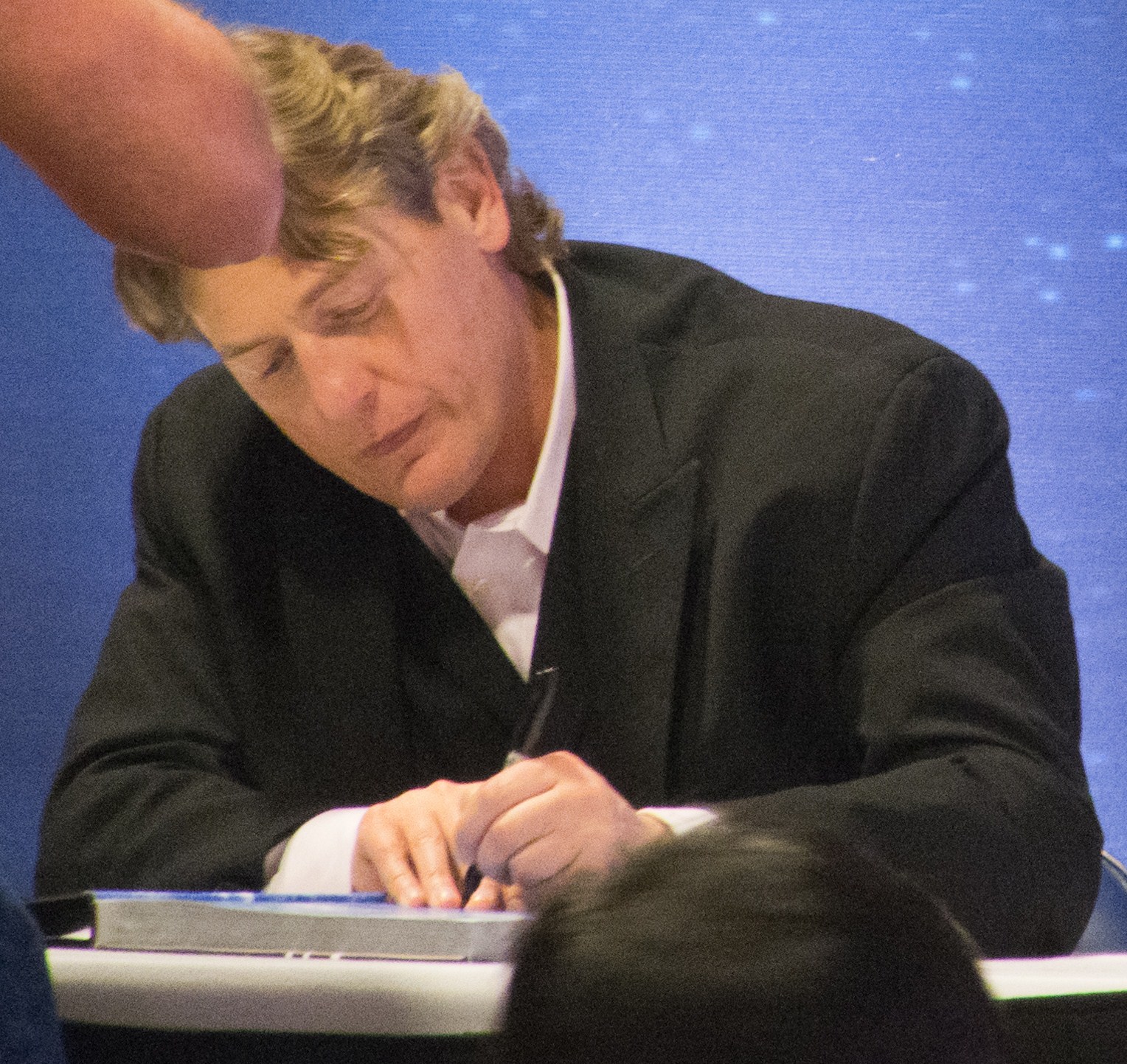William Regal signing autographs for fans at WrestleMania 28