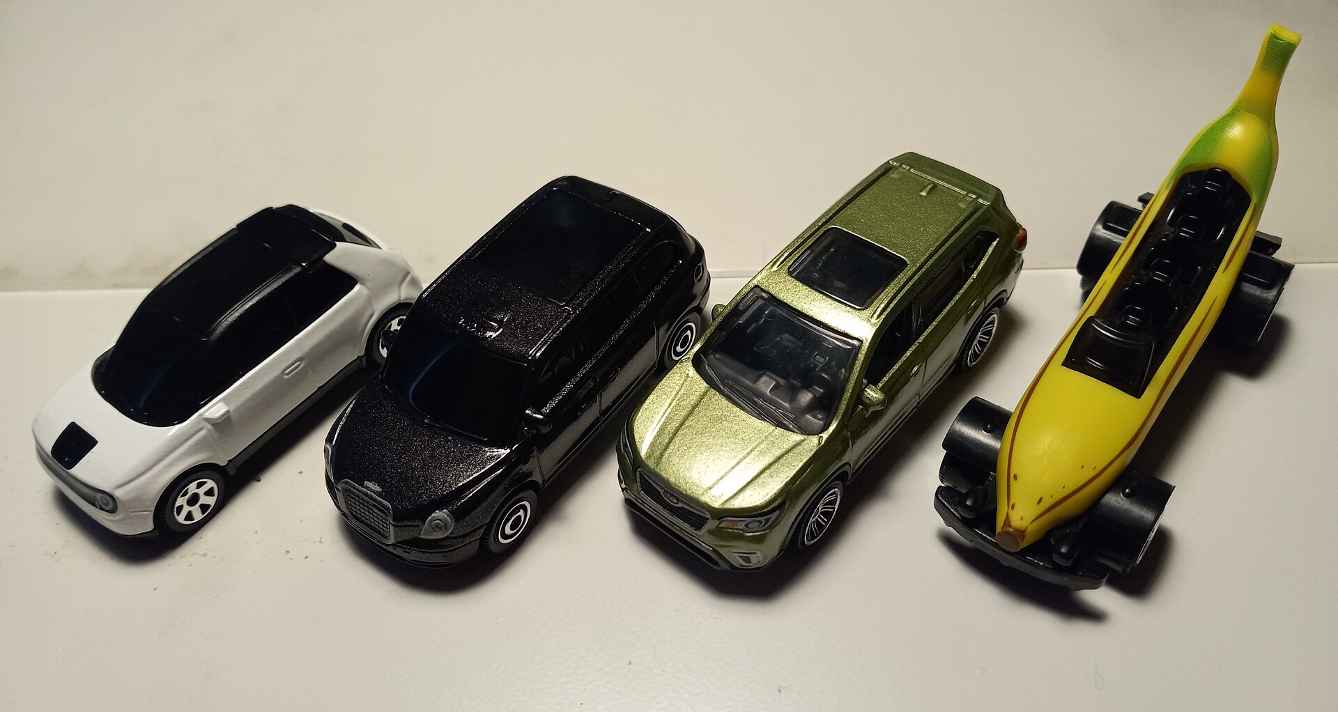 A collection of various Matchbox die-cast toy cars from 2020 to 2021, showing multiple colorful miniature vehicles