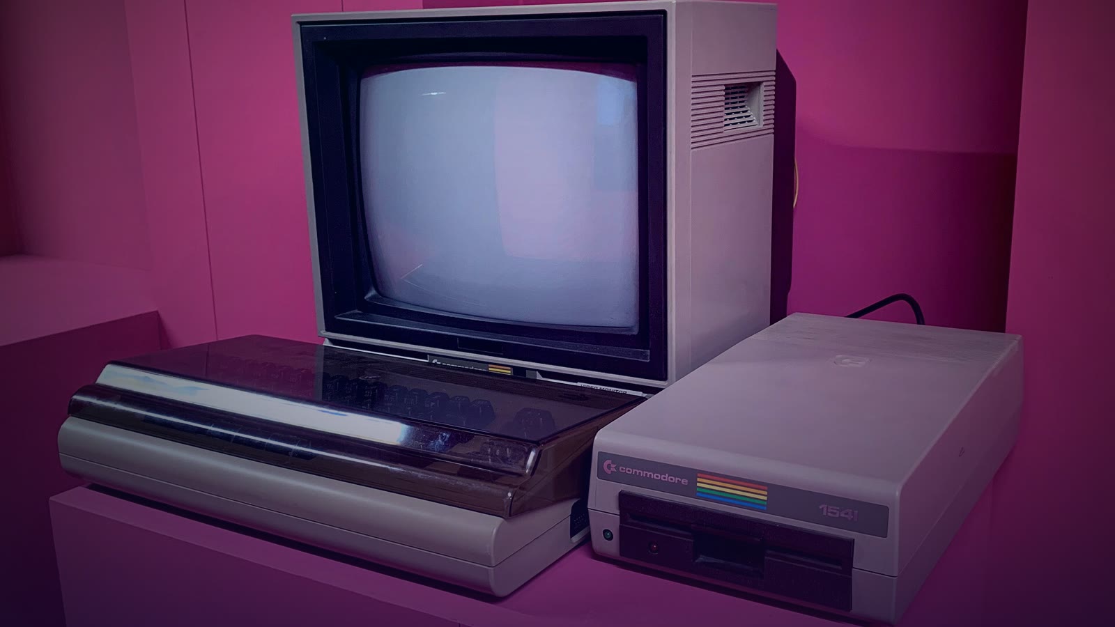 A Commodore 64 with its 1702 monitor and 1541 floppy drive on display